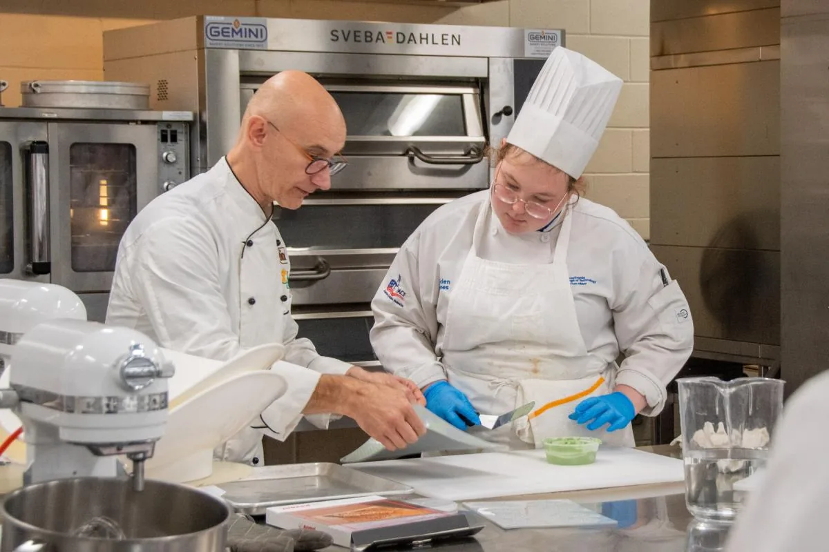 Map kitchen conditions by station for chef uniform fabric selection