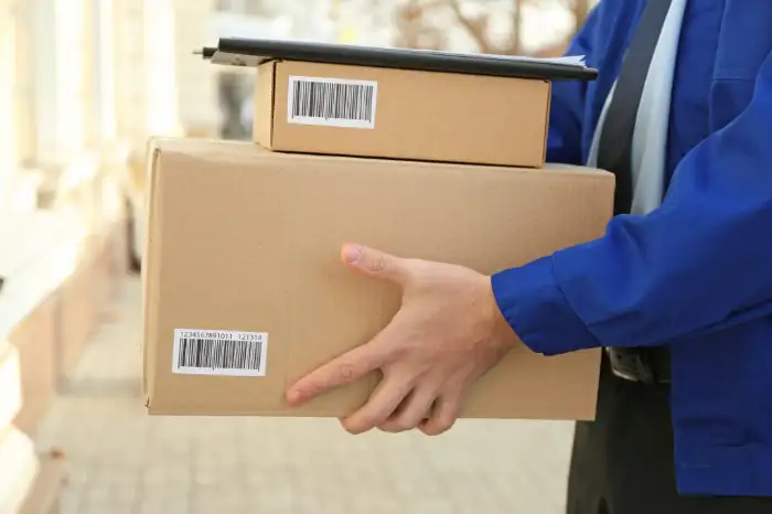 Stack of custom branded cardboard boxes ready for international shipping from LantaoWork