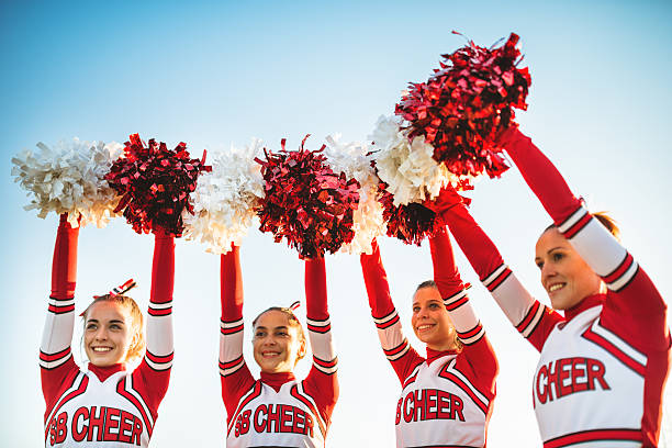 Cheerleading team in performance uniforms — dynamic athletic movement