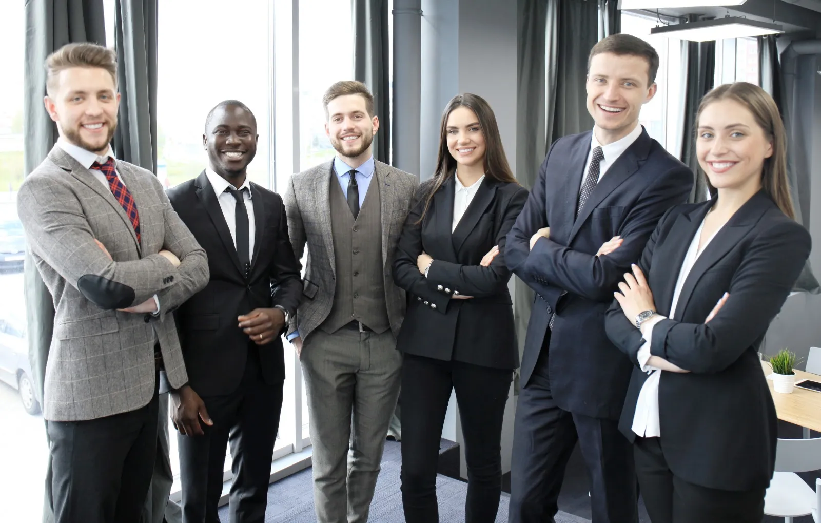 Professional corporate team in tailored business uniforms — enterprise manufacturing quality
