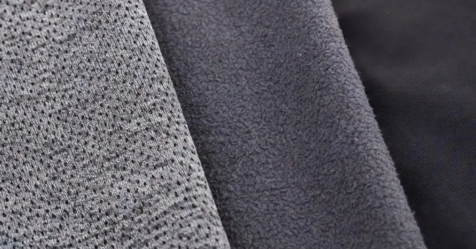 Fabric macro comparison — base layer thermal, mid layer fleece, outer layer shell textures side by side