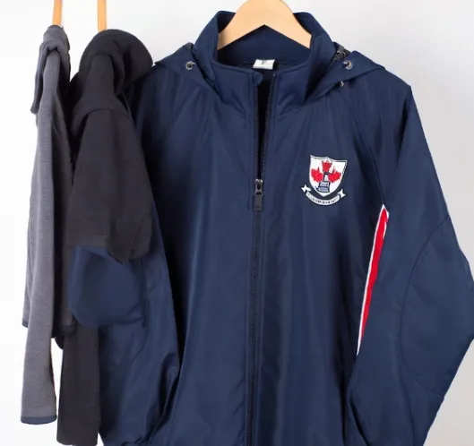 Three-layer cold-climate uniform system: base layer thermal, mid layer fleece, outer layer waterproof shell