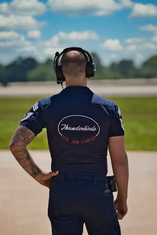 Custom embroidered coverall with precision logo stitching on chest pocket