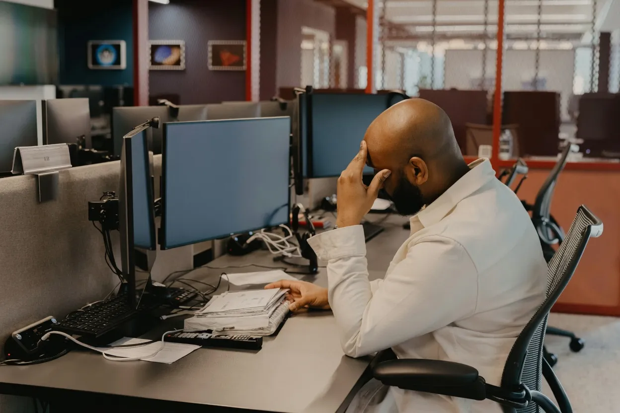 District procurement director reviewing shipping documents at desk