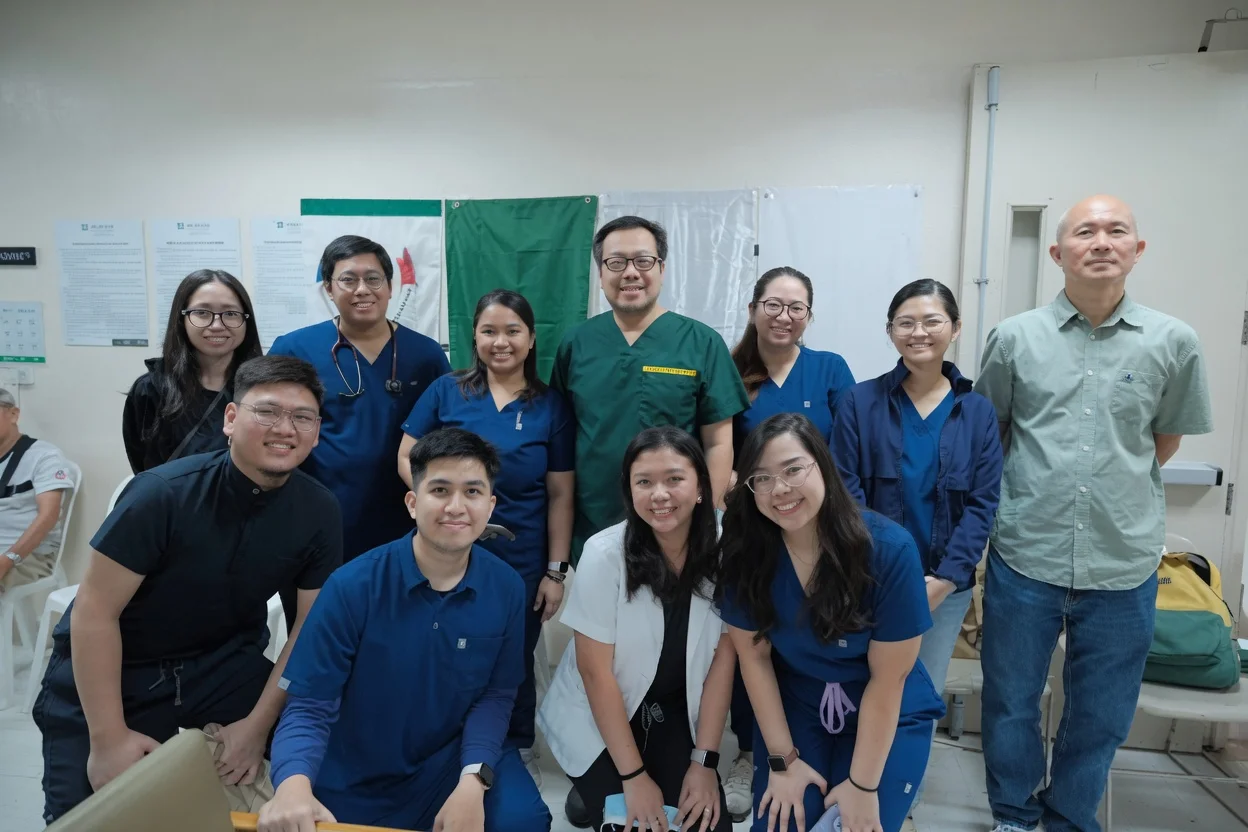 Teaching hospital staff in coordinated medical uniforms across departments