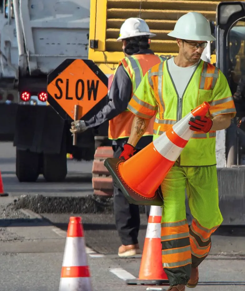 Hi-vis construction workers in a Class 2 fleet on site